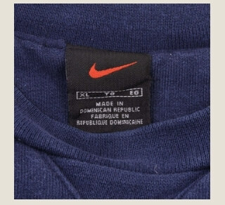 Vintage Nike red and black tag with a red swoosh above a separate size tag